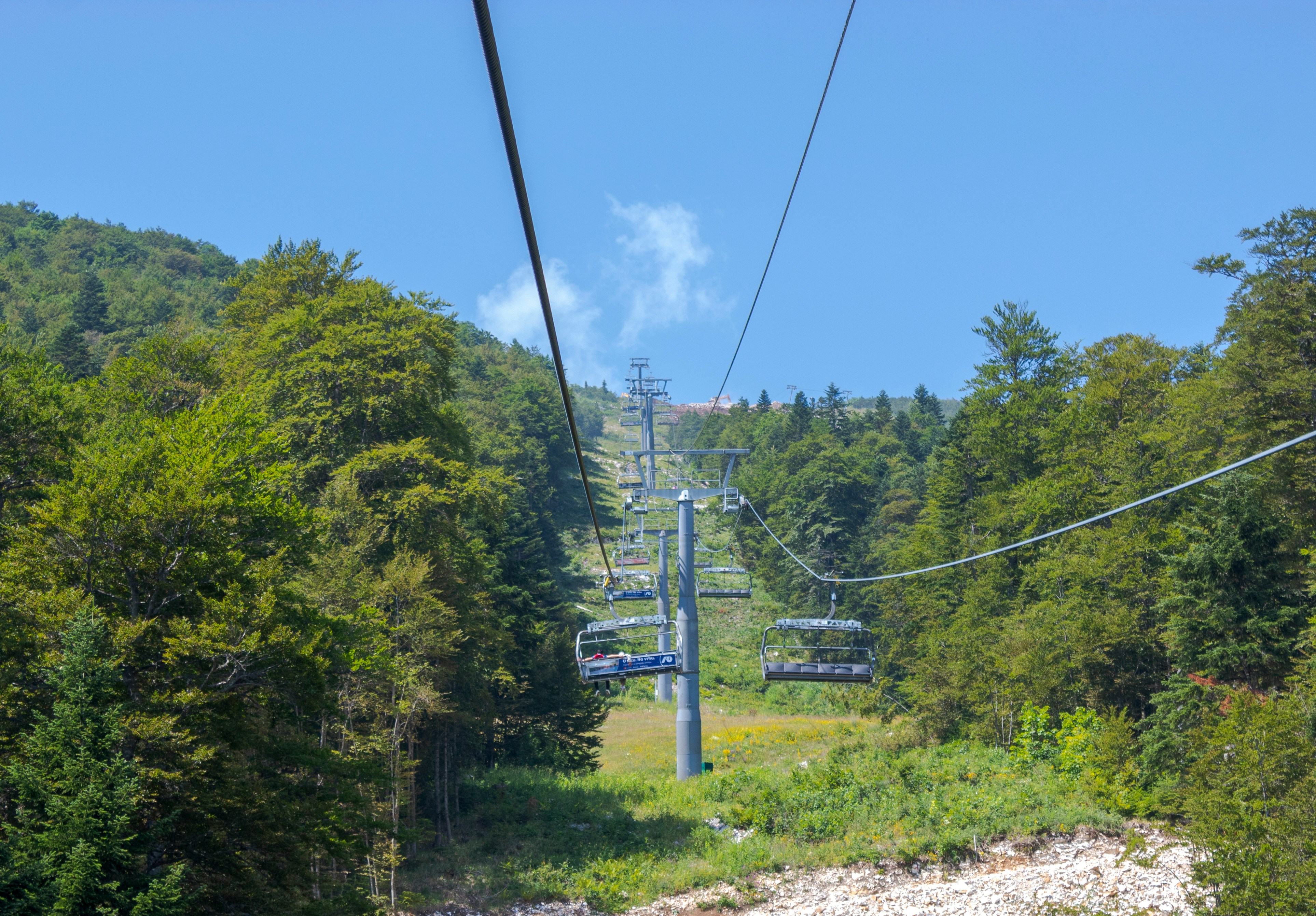 Ski lift chairlift against blue sky during summer season at Chicopee Resort